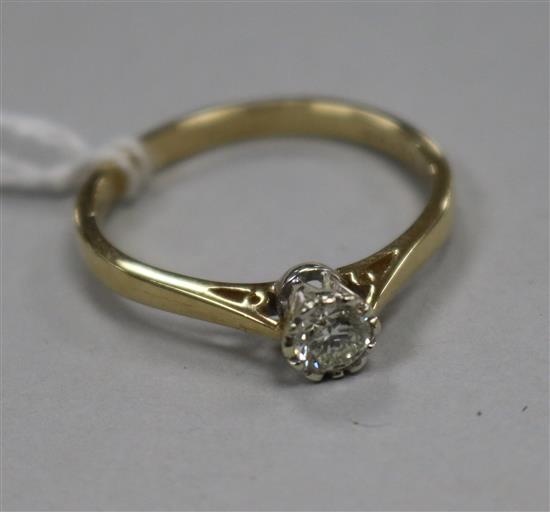 A modern 9ct gold and collet set solitaire diamond ring, size V.